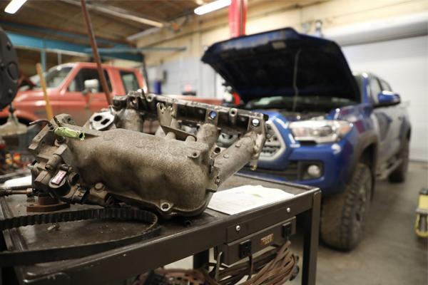 Intake manifold and trucks in a garage